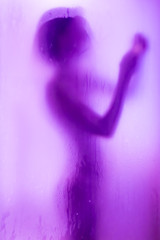 silhouette of a woman taking a shower