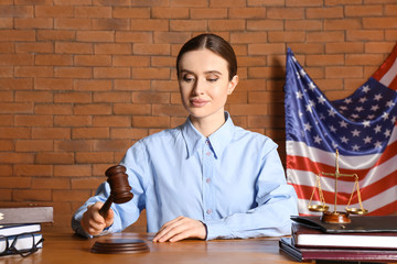 Female judge at table in courtroom