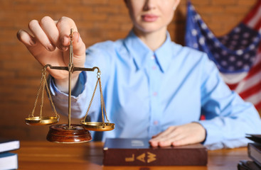 Female judge at table in courtroom, closeup