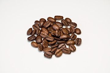 Set of fresh roasted coffee beans isolated on white background.