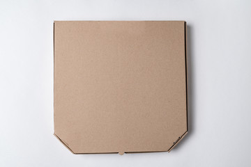 Cardboard pizza box on white background. Mockup, place for text.