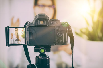 Video camera blog recording. Vlog blogger woman.