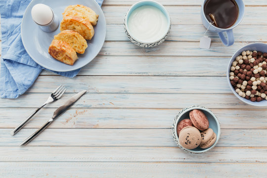 French fried toast with tea, boiled eggs and fresh yogurt. Tasty farmer breakfast.