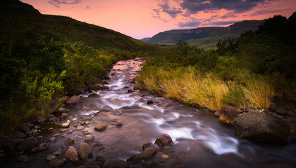 A beautiful river with golden hour skies in the central Drakensberg South Africa