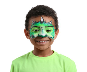 Funny African-American boy with face painting on white background