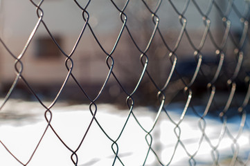 Rabitz fence on a background and texture with selective focus