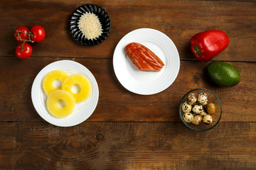 Ingredients for a pan-Asian salad are smoked chicken, pineapple, quail eggs, tomatoes and sesame.