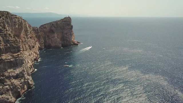 Aerial view of Capo Caccia Sardinian cliff with a lighthouse on the top 