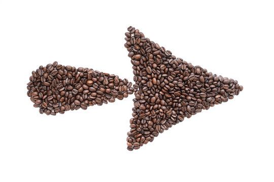 Coffee beans in the form of an arrow, on a white background.
