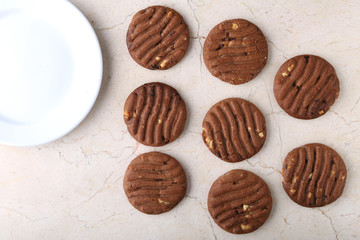 Flat lay composition with chocolate cookies and space for text on marble background