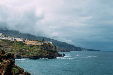Fototapeta na wymiar Landscape of the city on the Atlantic ocean. Tenerife, Puerto de la Cruz. A tropical island in the Atlantic ocean. Photo for a tourist destination