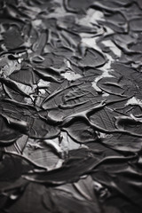 Acrylic black paint close-up. Texture background