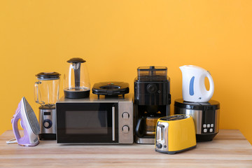 Different household appliances on table