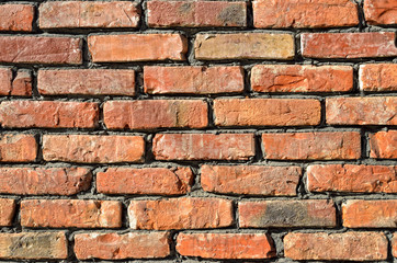Texture of the old brick. The rough surface of a brick wall.