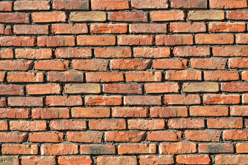 Texture of the old brick. The rough surface of a brick wall.