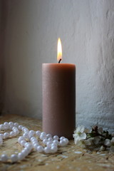 candles and flowers. candles and rose petals. candle on wooden background