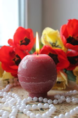 candles and flowers. candles and rose petals. candle on wooden background