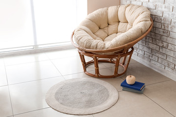 Fototapeta na wymiar Comfortable armchair in interior of living room