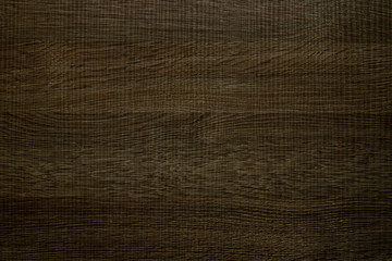 Fototapeta na wymiar Laminated panel with dark wood texture, background.