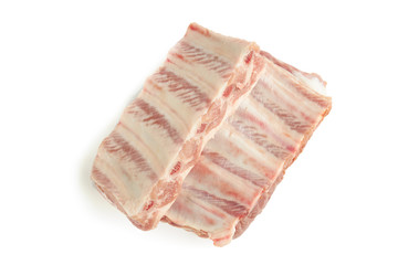 fresh raw pork ribs isolated on a white background. two pieces. ingredient for meat cuisine. above view