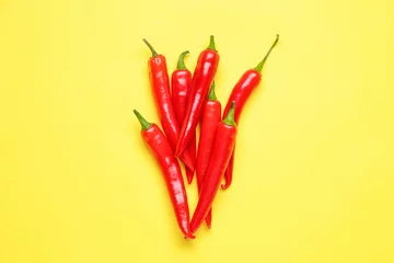 Gordijnen Hot chili pepper on color background © Pixel-Shot