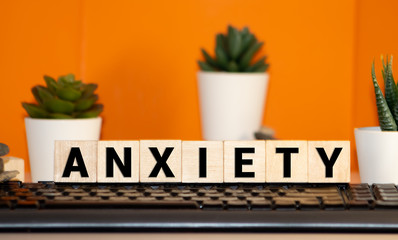 ANXIETY word made with building blocks isolated on white