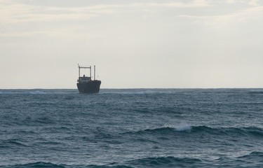 Ship in White River Beach Lara Bay in Cyprus