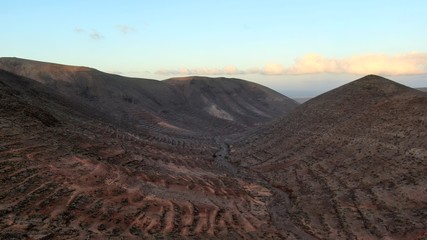 Sunset between mountains and ravines