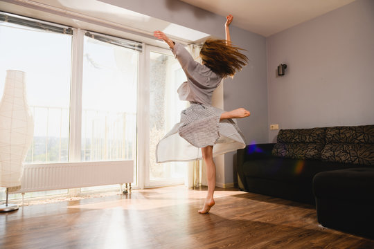 Woman dancing at home at isolation time