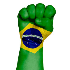 A discreet image of a fist painted in the colors of the flag of Brazil. Image on a white background.