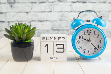June 13 on the wooden calendar.The thirteenth day of the summer month, a calendar for the...