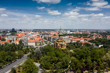 Fototapeta premium Timisoara city downtown and the central park, arial view with nice clouds on blue sky