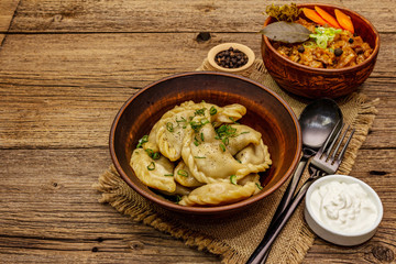 Dumplings stuffed stewed cabbage and sour cream. Traditional Ukrainian dish varenyky