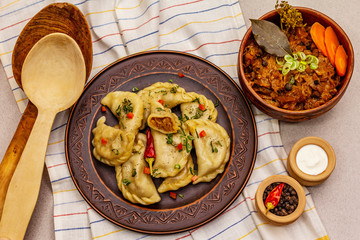 Dumplings stuffed stewed cabbage and sour cream. Traditional Ukrainian dish varenyky