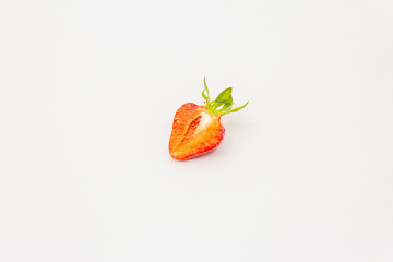 Half sweet fresh strawberry isolated on white background