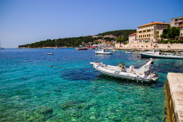 Fototapeta na wymiar Boats anchored in a small bay south of Hvar city on Hvar island in Croatia - Dalmatian summer in the Adriatic Sea