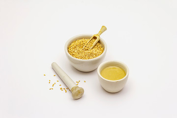Tahini with sesame seeds isolated on white background