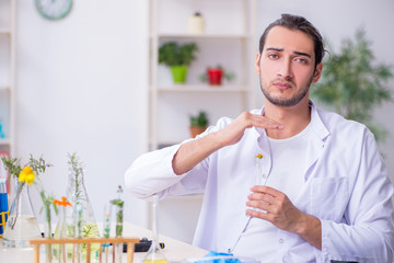 Young male chemist working in the lab