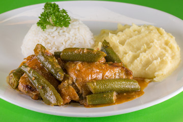  Frango com quiabo. Brazilian food. A chicken meal with okra served with rice and mashed potatoes