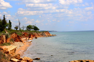 Beautiful wild Beach Fontanka  near Odessa. Yellow and red sandstone cliffs are located on the...