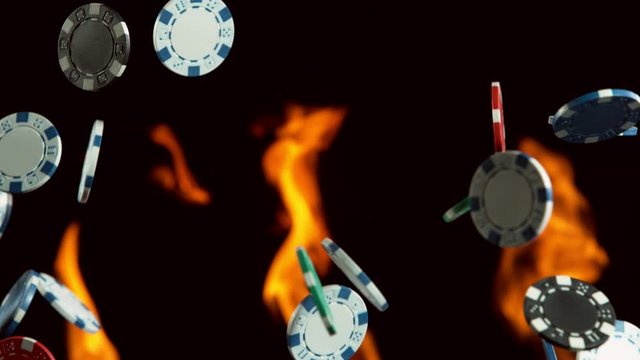 Super slow motion of rotating poker chips with flames on background. Filmed on high speed cinema camera, 1000fps.