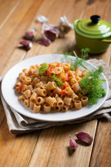pasta with garlic and tomato - Italian food - closeup