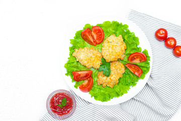 Chopped chicken meatballs on lettuce leaves. Baked chicken fillet cutlets. Dietary dish. Concept of shooting food for the menu. The dish of the restaurant. Beautiful serving of food.