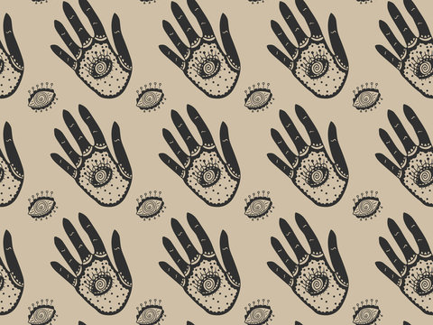 Seamless elegant magic pattern of black ornamental hands with all-seeing eyes inside the palms and the outside on a gold background. Ornament on the theme of providence. Vector.