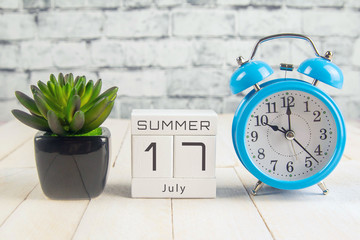 July 17 on the wooden calendar.The seventeenth day of the summer month, a calendar for the...