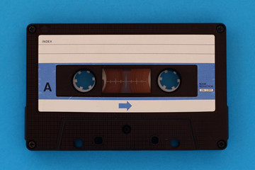 Vintage Cassette tape on a blue background with copy space