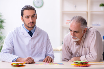 Doctor and patient suffering from Alzheimer disease