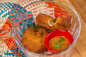 seafood croquette with sauce in bowl. top view