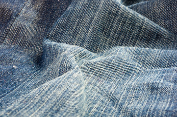 clothing items blue stonewashed faded jeans cotton fabric texture with seams, clasps, buttons and...
