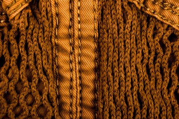 clothing items stonewashed cotton fabric texture with seams, clasps, buttons and rivets, macro